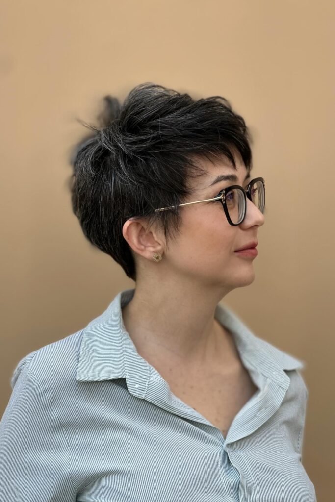 67. Sophisticated Dark Pixie Cut with Textured Top