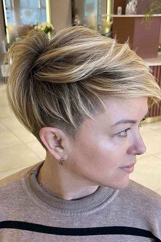 61. Textured Blonde Pixie Cut with Undercut
