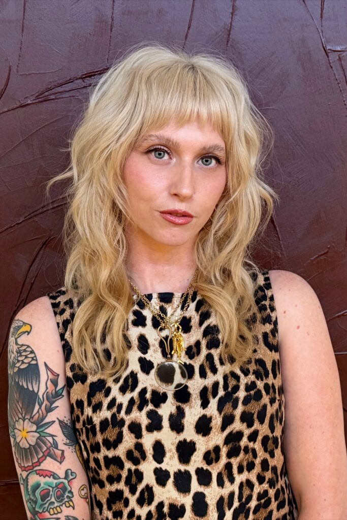 24. Textured Blonde Shag with Choppy Bangs