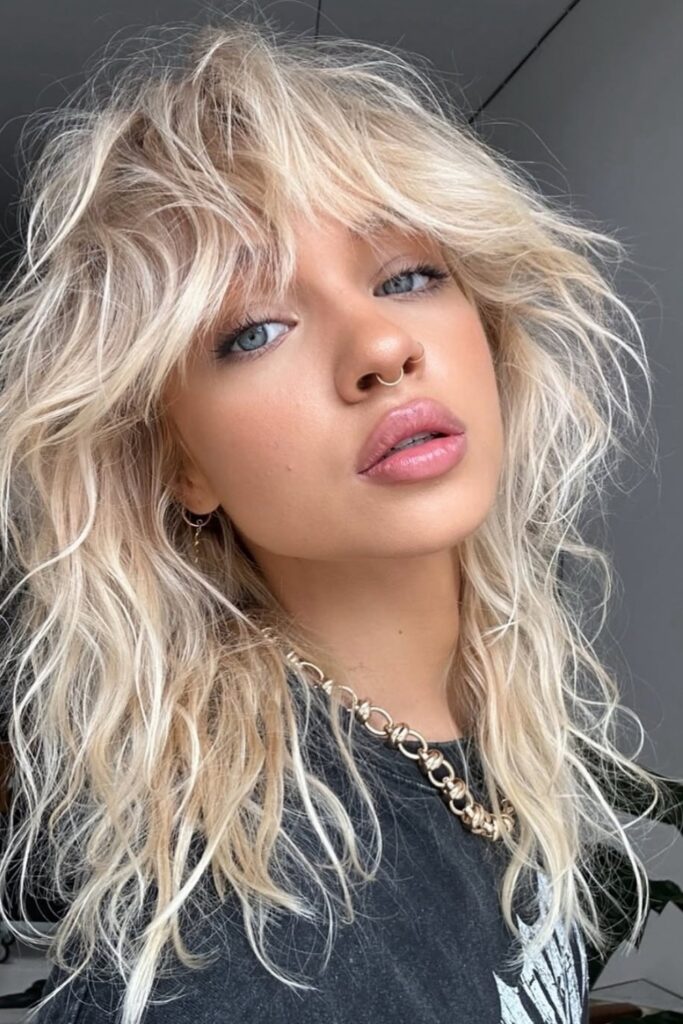 33. Tousled Platinum Shag with Face-Framing Layers