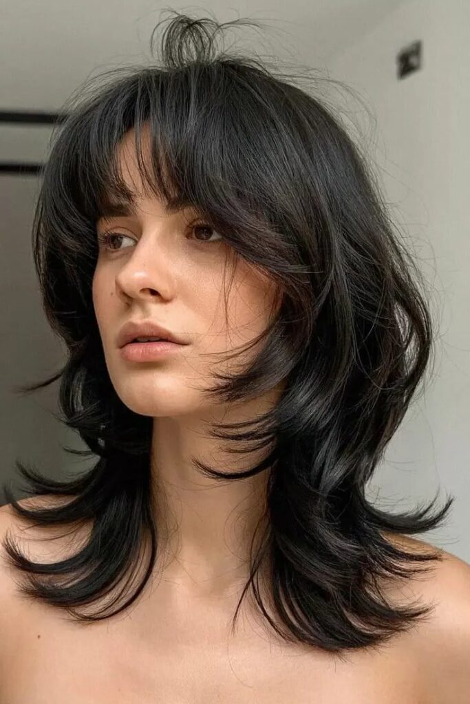 Jet Black Shaggy Cut with Feathery Layers and Bangs