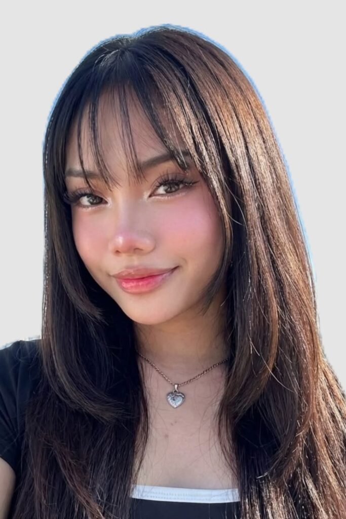 Long Layered Hair with Side-Swept Bangs