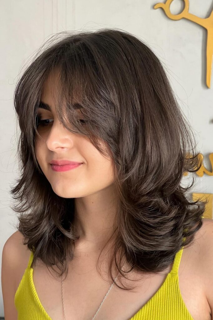 Medium-Length Layered Cut with Soft Side-Swept Curtain Bangs