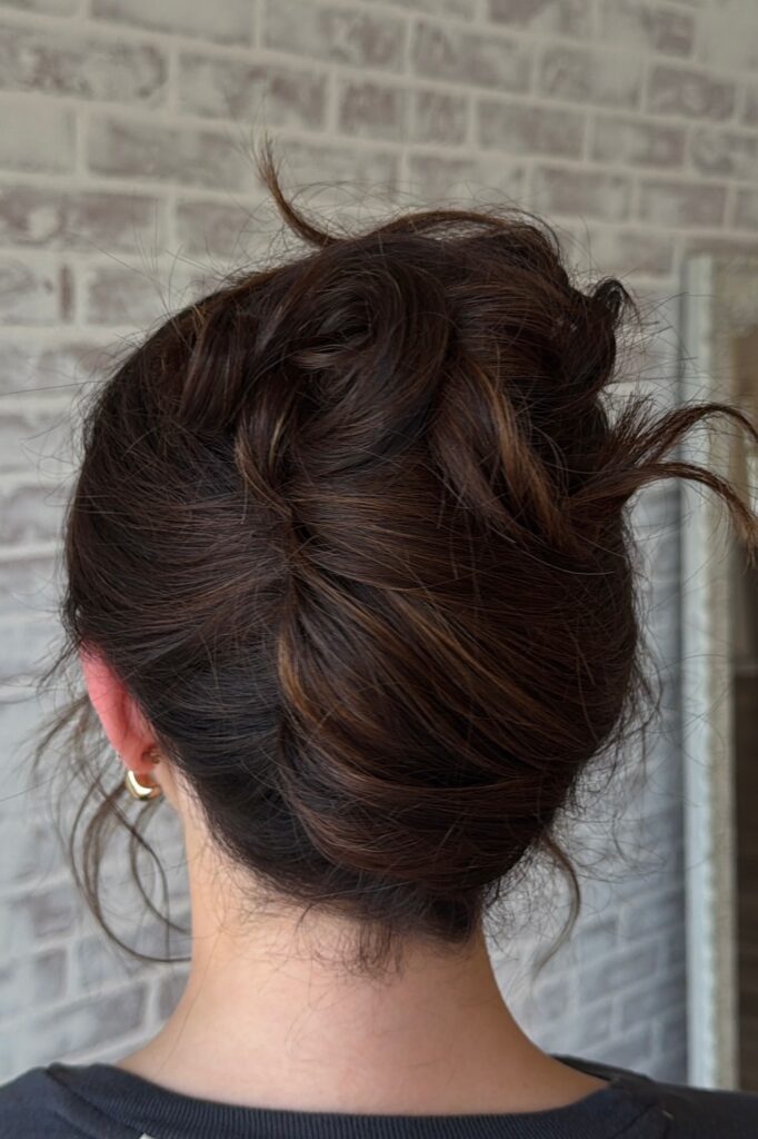 Messy Low Bun with Tousled Texture and Loose Pieces