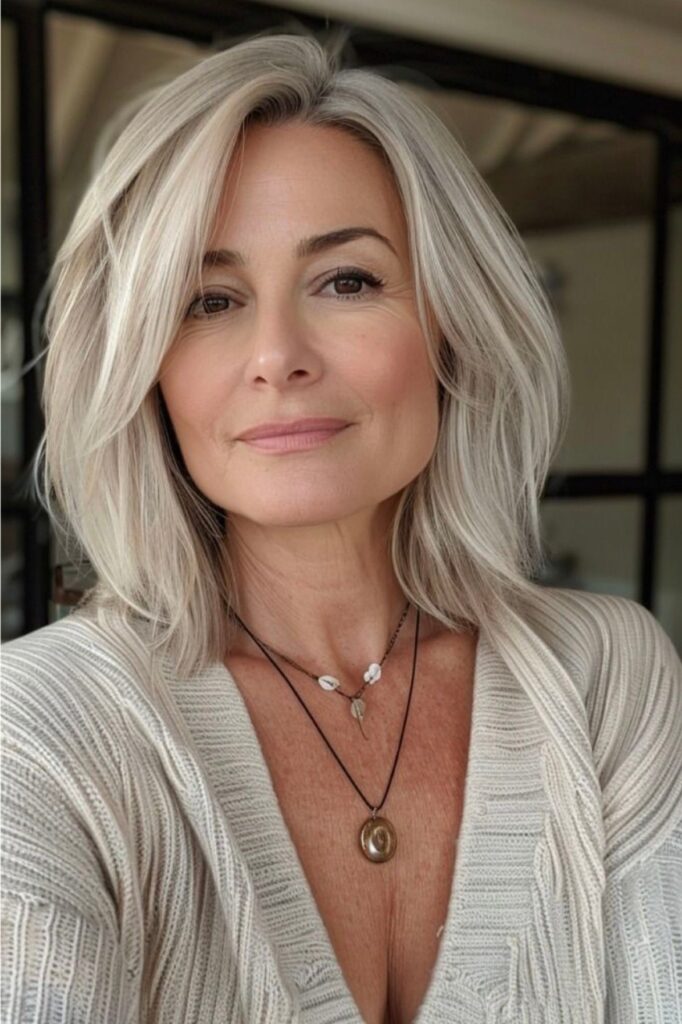 Sleek Layered Shoulder-Length Hair with Side Part
