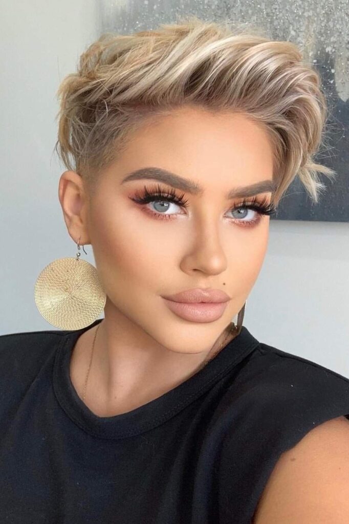 Textured Blonde Pixie Cut with Undercut and Voluminous Top