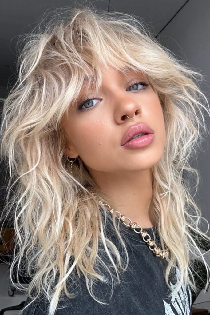 1. Textured Shag with Curtain Bangs