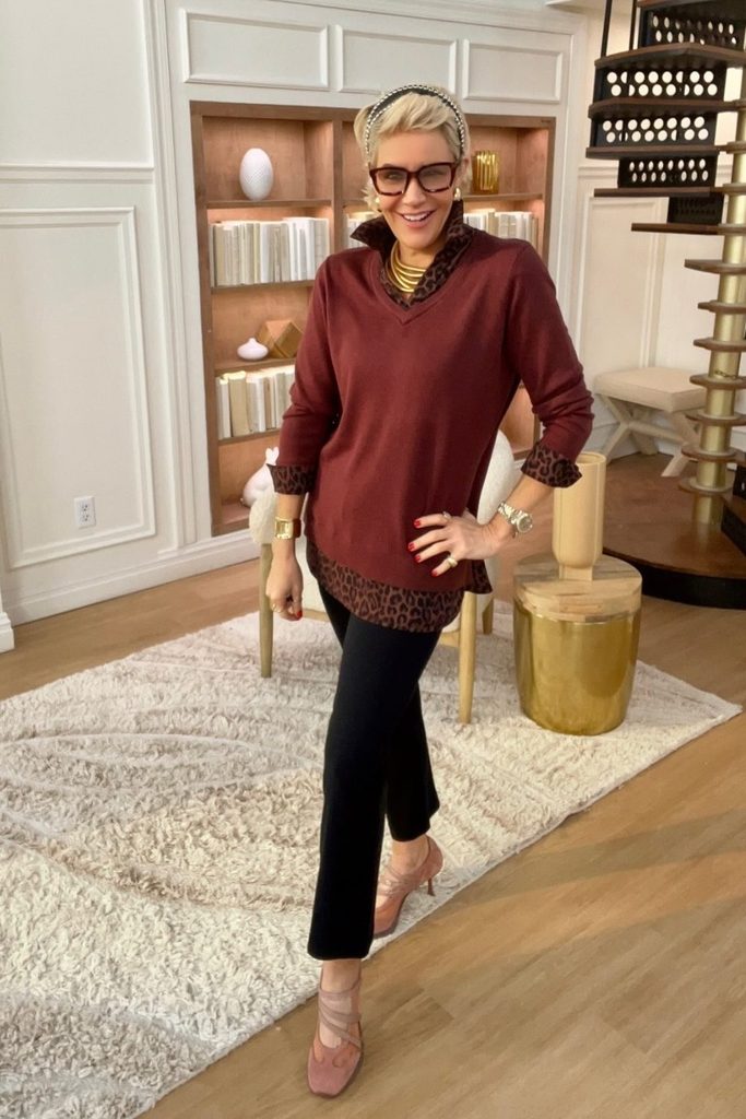 Leopard print trim peeking from a burgundy tunic adds a playful edge to flare pants.