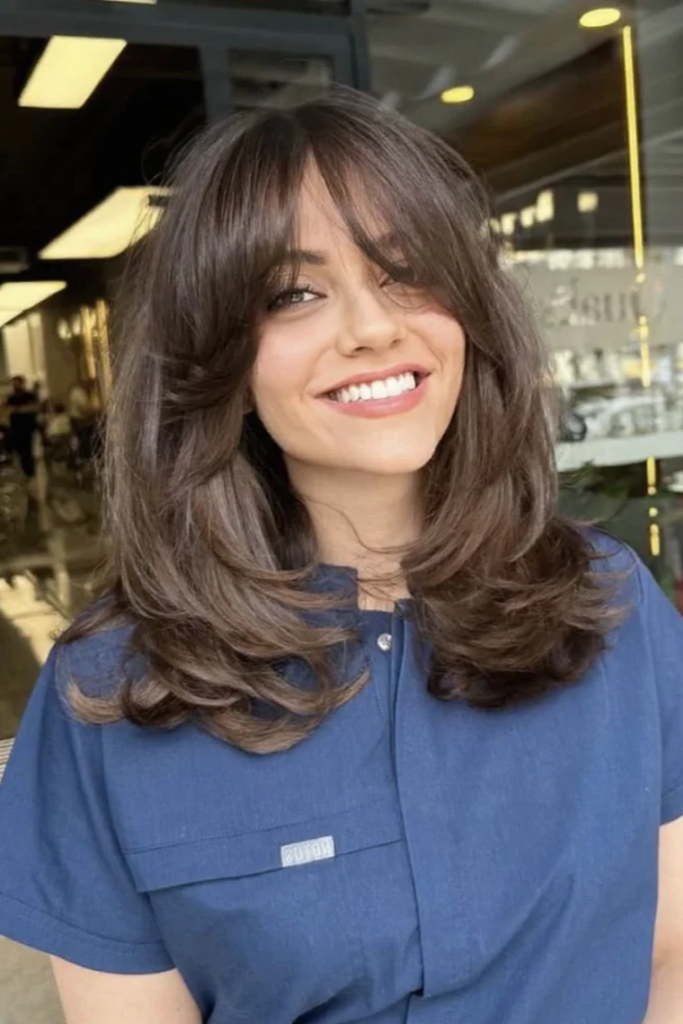 Voluminous Layered Cut with Thick Curtain Bangs